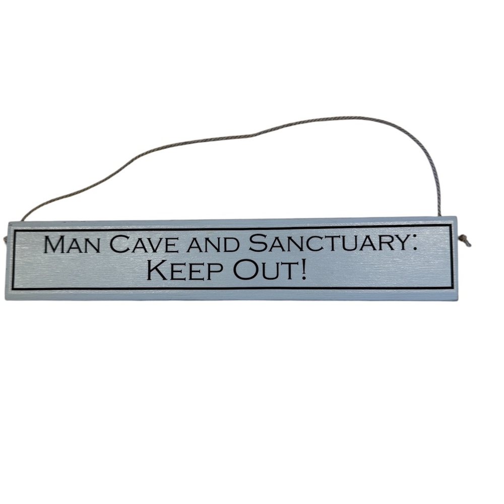 Novelty sign reads‎ "MAN CAVE AND SANCTUARY :KEEP OUT !!